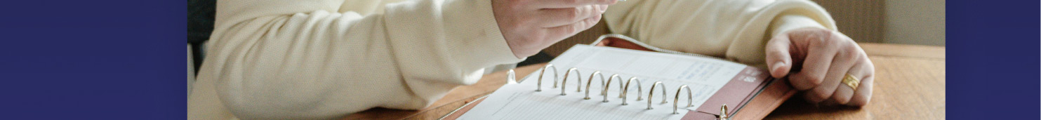 Image, man working with his planner.